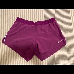 Pink Nike running shorts